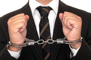 suit in handcuffs